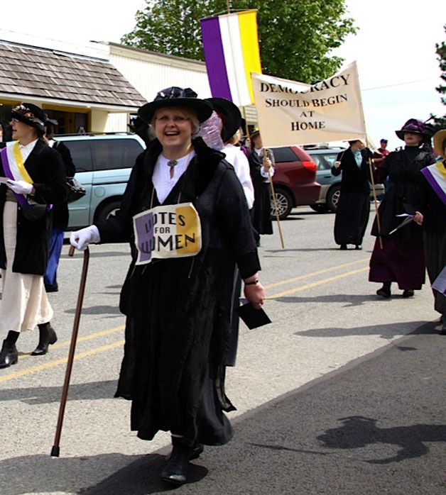 Vicki Welfare is among the marchers Saturday. When Welfare is not pushing for women’s rights she works for the Langley Library.