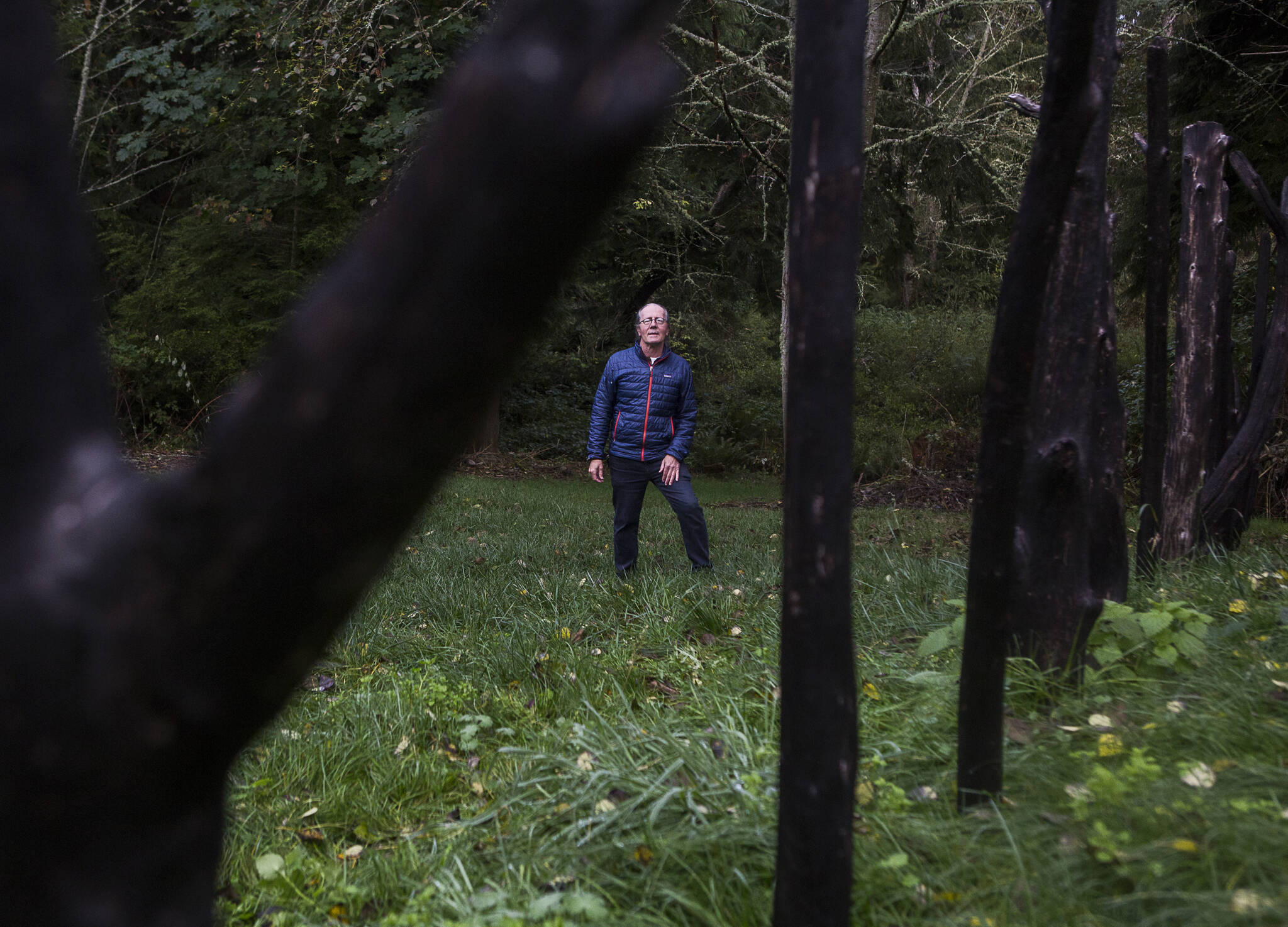Earth Sanctuary owner Chuck Pettis next to his Ley Line piece on Tuesday, Oct. 20, 2020 in Langley, Wa. (Olivia Vanni / The Herald)