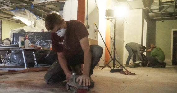 Photo by Sam Fletcher
Ariah Bepler of Kings-Men Construction sands Jumbo Burrito’s floor to prepare the restaurant to re-open in two weeks.