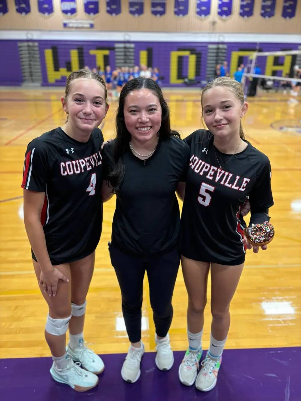 (Sarah Stuurmans photo)
Lyla Stuurman, at left, hangs out with CHS coach Scout Smith and lil’ sis Tenley.