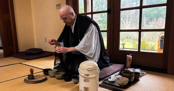 Tendo, head monk at Tahoma One Drop Zen Monastery, leads a tea ceremony. (Photo by Sam Fletcher)