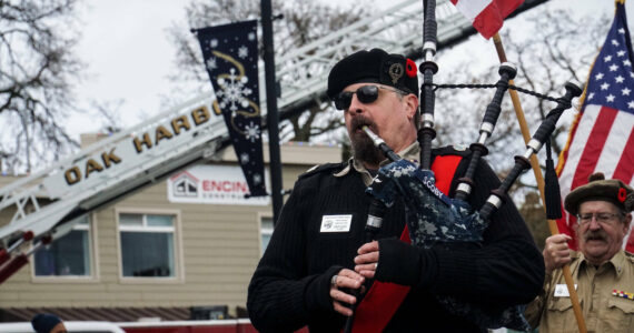 Don Scoby, author of "The Shanty Piper" plays at the Veteran's Day Parade in Oak Harbor. (Photo by Sam Fletcher)
