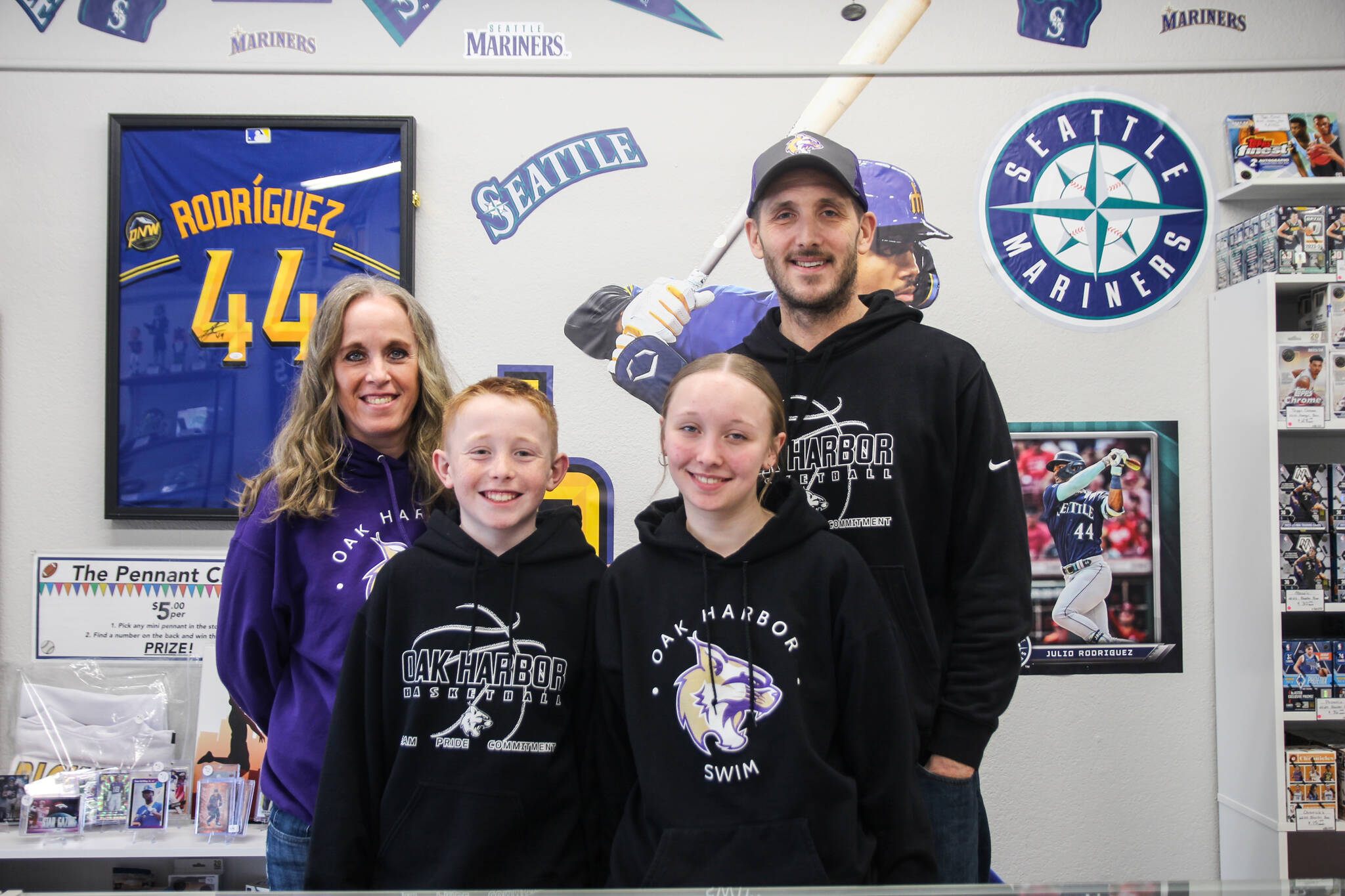At left, Abby, Hunter, Tessa and Chad Meyer pose together in their new Oak Harbor shop. (Photo by Luisa Loi)