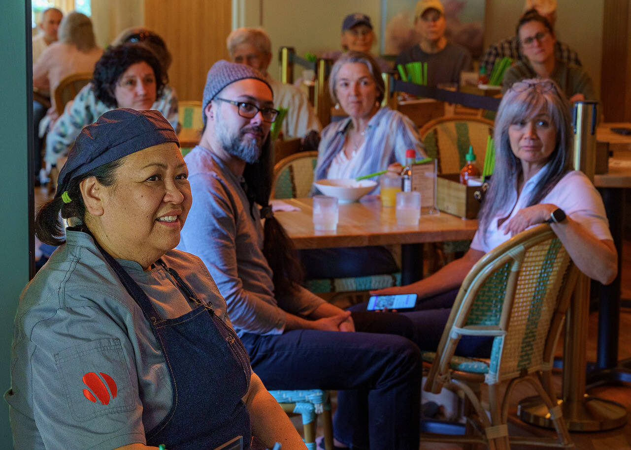 Photo by David Welton
Joan Samson, left, watches the premiere for season two of “Morimoto’s Sushi Master” with friends.