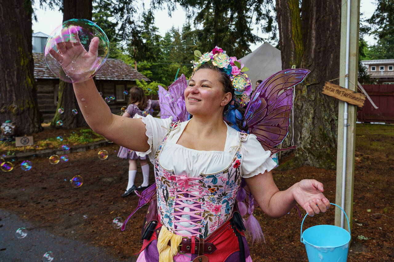 Photo by David Welton
A fairy catches a bubble during the Ren Faire last year.