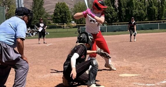 (Photo by Kristi Stevens)
Chelsi Stevens digs in during the state tourney.
