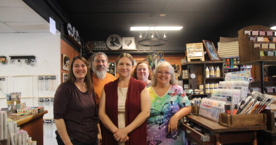 Business owner Trish Sillavan, at center, stands inside Ember and Elegance with vendors Jobeth Glenday, Tim Goette, Maria Fazio and Wendy Grimsley,