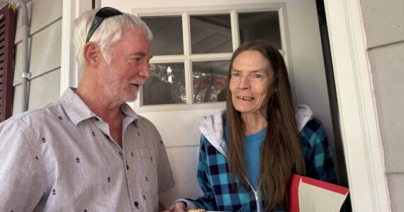 Volunteer Ron Ward with Theresa Williams, a Meals on Wheels recipient (photo courtesy of Island Senior Resources).