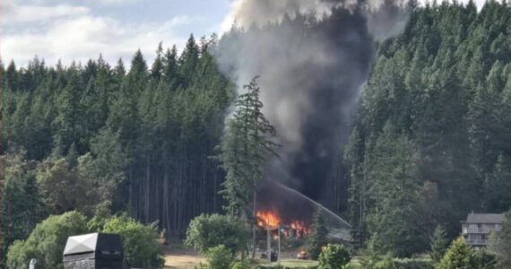 Photo by Cherie Tober A Whidbey Island home caught fire after an explosion.