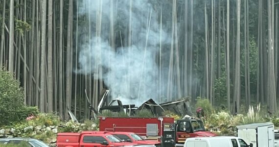 The remains of a house were still smoking the day after an explosion and fire destroyed the structure and killed a man.