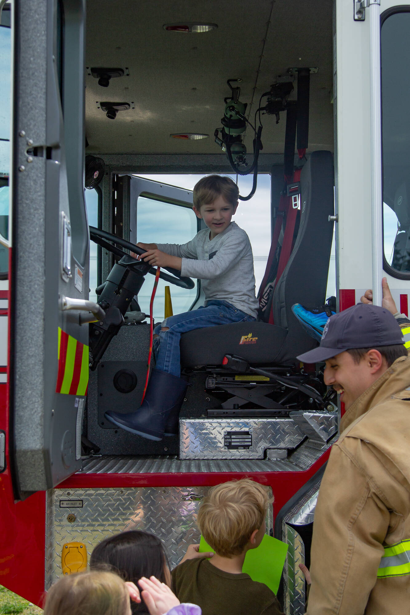 Children take turns getting into the cap of a truck during last year’s event (File photo)