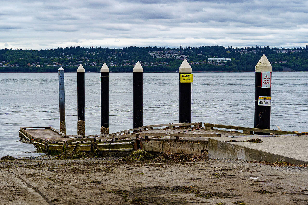 At a lower tide, the deterioration of the Possession Beach Waterfront Park boat launch becomes clearer as the warped floats twist into a perilous shape (Photo by David Welton)