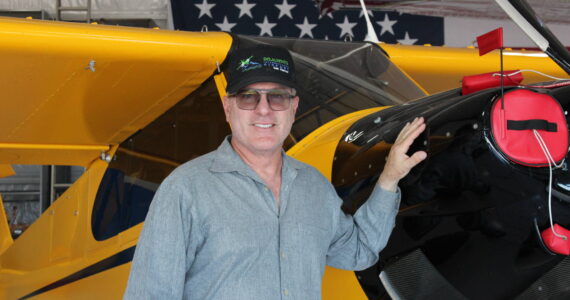 Robert DeLaurentis poses in front of one of his planes (Photo by Allyson Ballard).