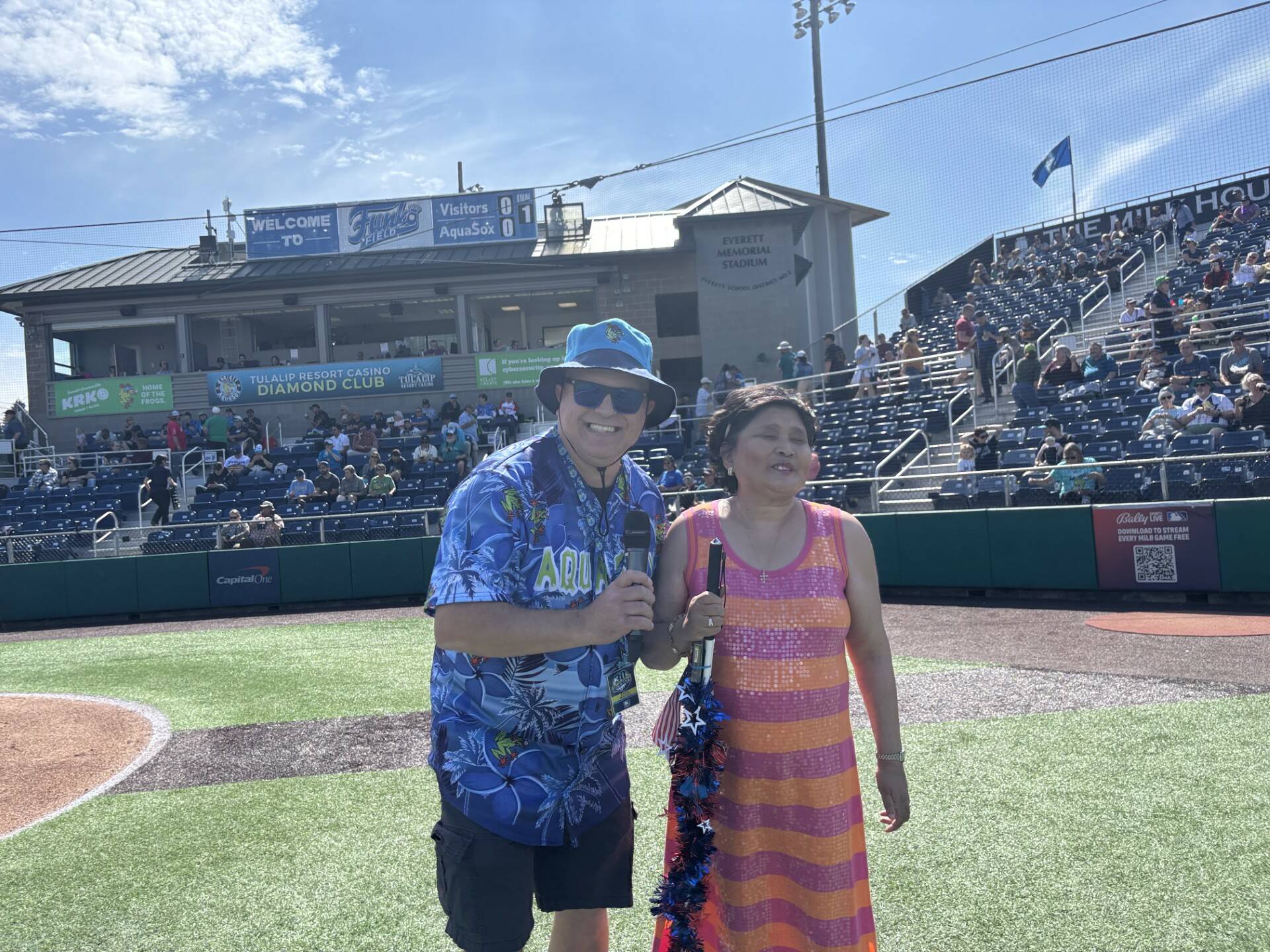(Photo provided) Singer Mira Arcilla stands next to Everett AquaSox On-Field Emcee Steve Willits.