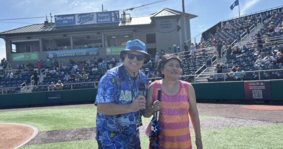 Photo provided 
Singer Mira Arcilla stands next to Everett AquaSox On-Field Emcee Steve Willits.