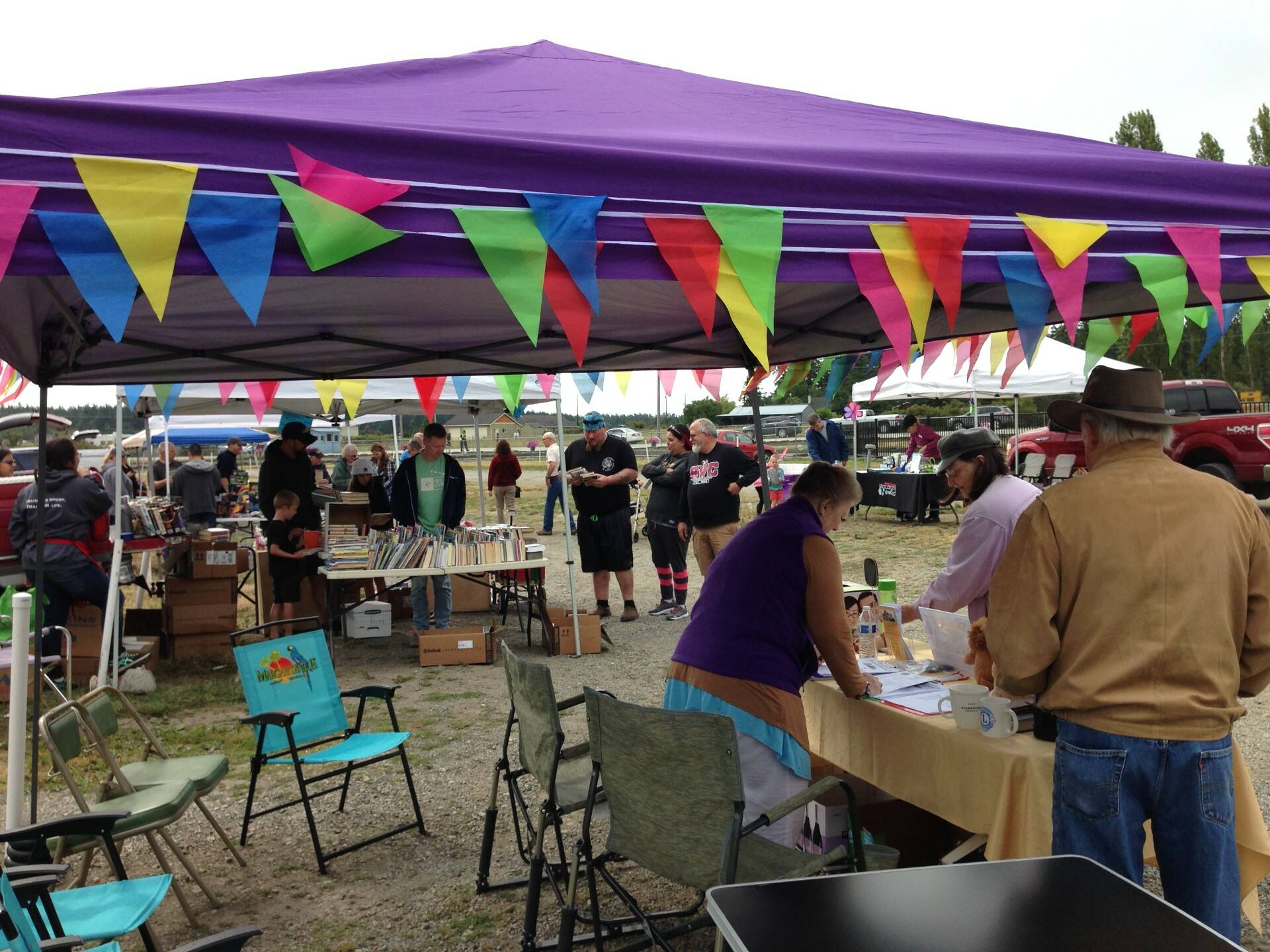 (Photo provided) Booths are decorated with colorful flags.