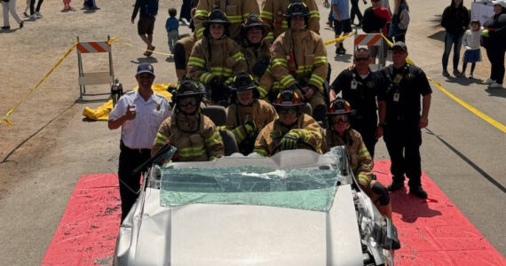 South Whdibey firefighters demonstrate the different ways they can manipulate the vehicle in order to get patients out of the vehicle safely at the Whidbey Island Fair.