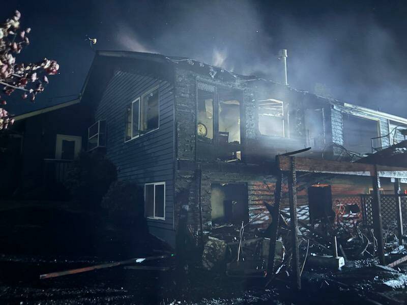 (Photo by South Whidbey Fire/EMS) A Clinton home suffered extensive damage when it caught fire early Tuesday morning. The residents were displaced but uninjured.