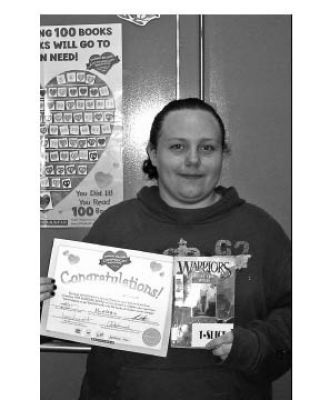 Well read: Eagle River Secondary student Kayla Witowsi shows off an award she received for most books read in her class (seven in total) as part of Scholastic Canada’s ClassroomsCare program