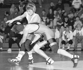 Shown here wrestling at home in December